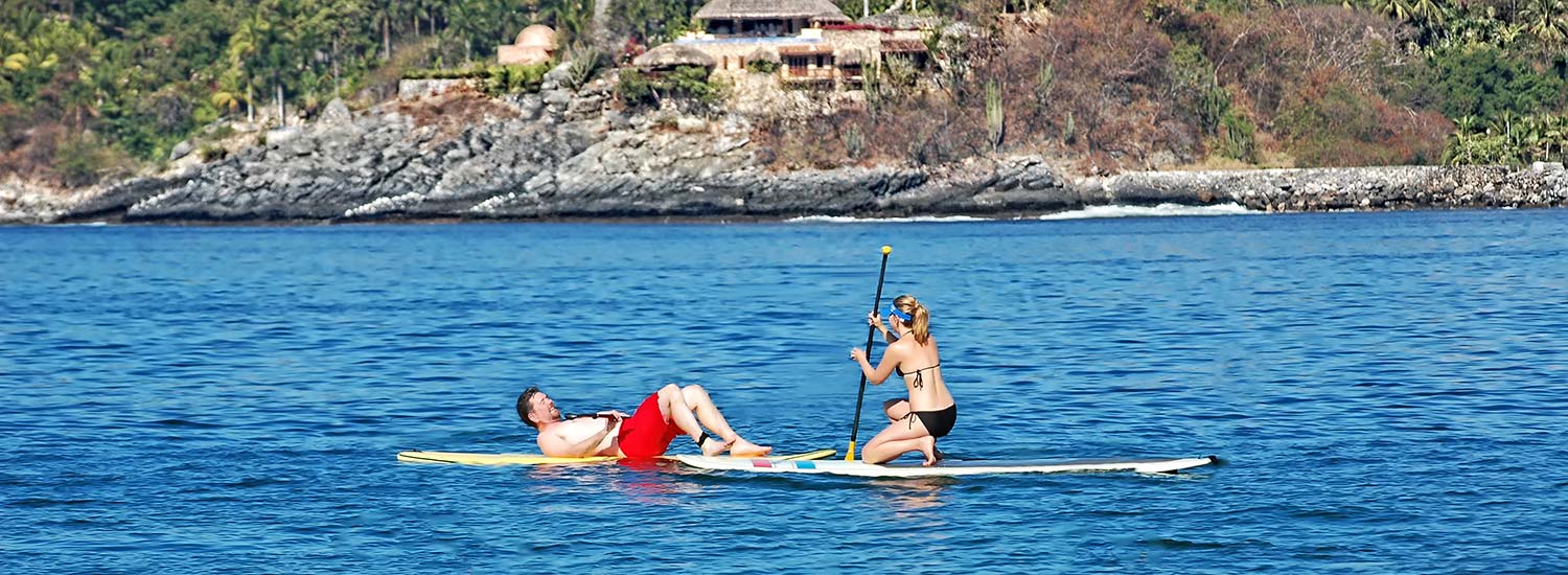 A couple SUPs in Zihuatanejo Bay
