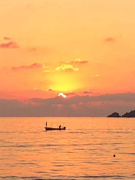 Fishermen in Zihuatanejo Bay at sunset